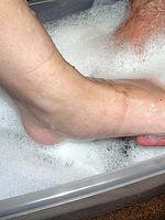 Washing her feet 